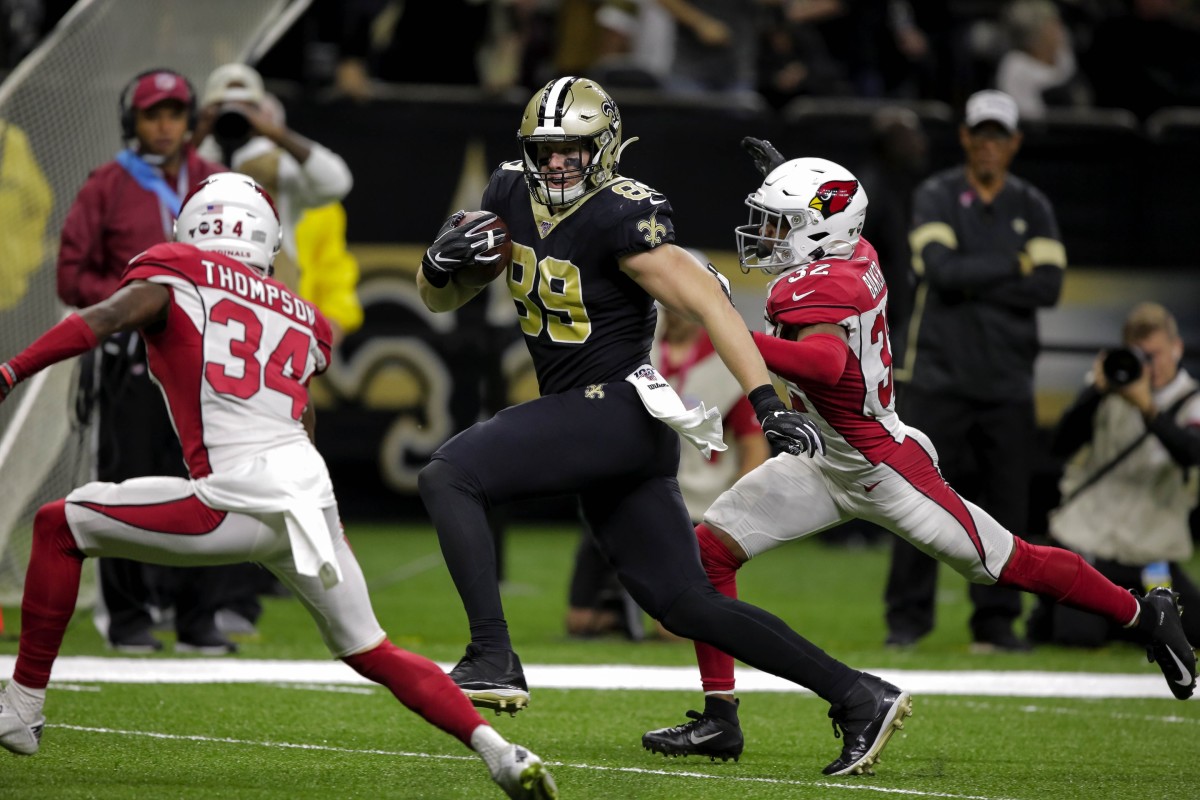 Oct 27, 2019; New Orleans, LA, USA; New Orleans Saints tight end Josh Hill (89) runs past Arizona Cardinals defensive back Jalen Thompson (34) and strong safety Budda Baker (32) during the fourth quarter at the Mercedes-Benz Superdome. Mandatory Credit: Derick E. Hingle-USA TODAY Sports