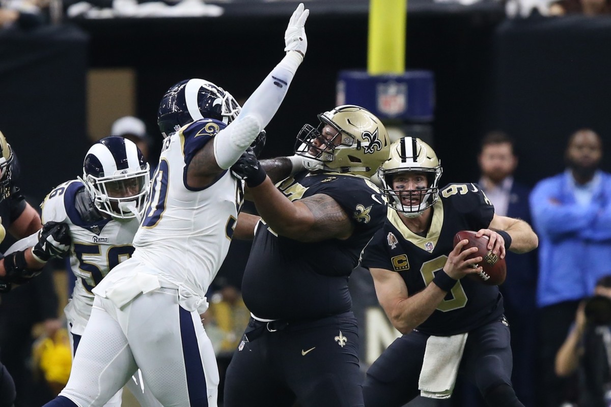 Jan 20, 2019; New Orleans, LA, USA; Los Angeles Rams defensive end Michael Brockers (90) pressures New Orleans Saints quarterback Drew Brees (9) as Saints offensive lineman Larry Warford (67) blocks during the second quarter the NFC Championship game at Mercedes-Benz Superdome. Mandatory Credit: Chuck Cook-USA TODAY Sports
