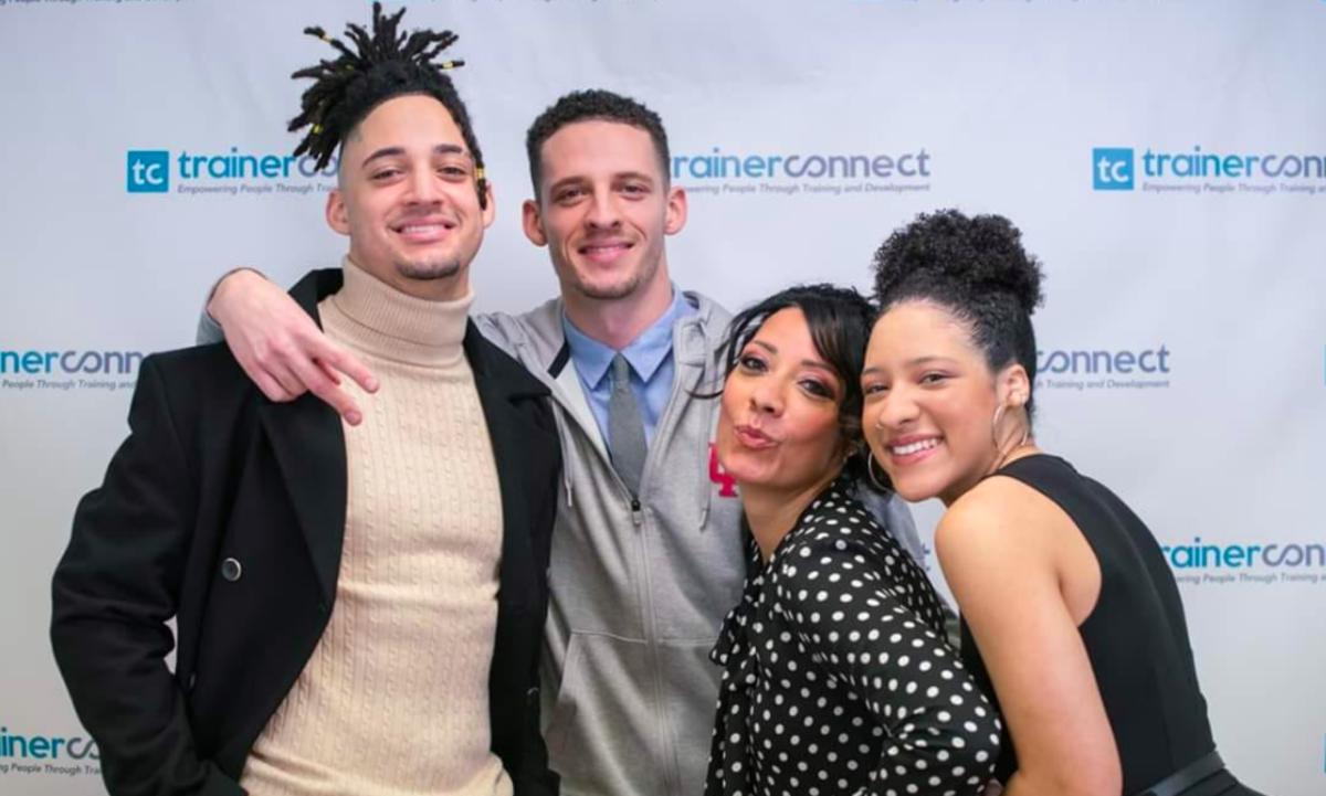 Cassandra Wilson is pictured with her three children recently, including her son Cam (far left), who is a wide receiver on Indiana's football team. 