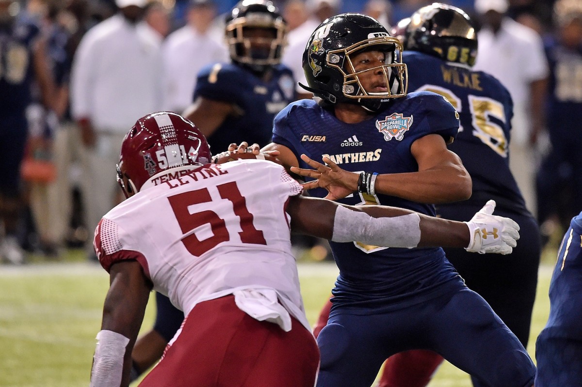 Dec 21, 2017; St. Petersburg, FL, USA; Temple Owls defensive lineman Dana Levine (51) pressures FIU Panthers quarterback Maurice Alexander (3) during the second half in the 2017 Gasparilla Bowl at Tropicana Field.
