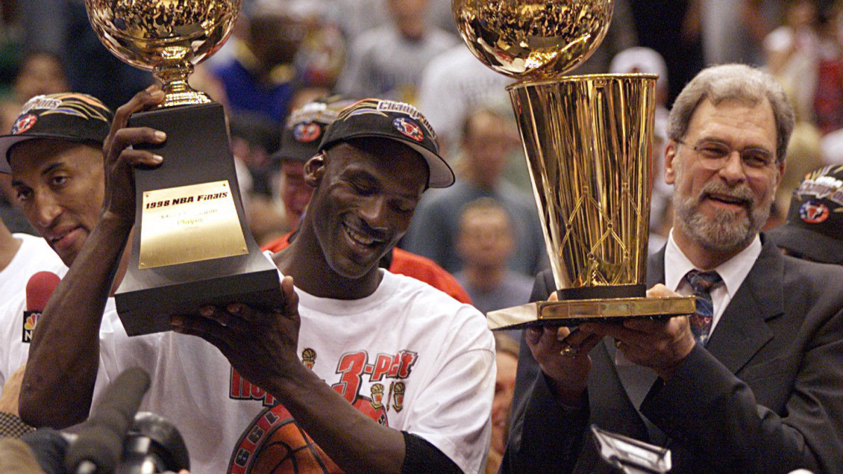 Michael Jordan celebrates with Phil Jackson after winning the 1998 NBA Finals