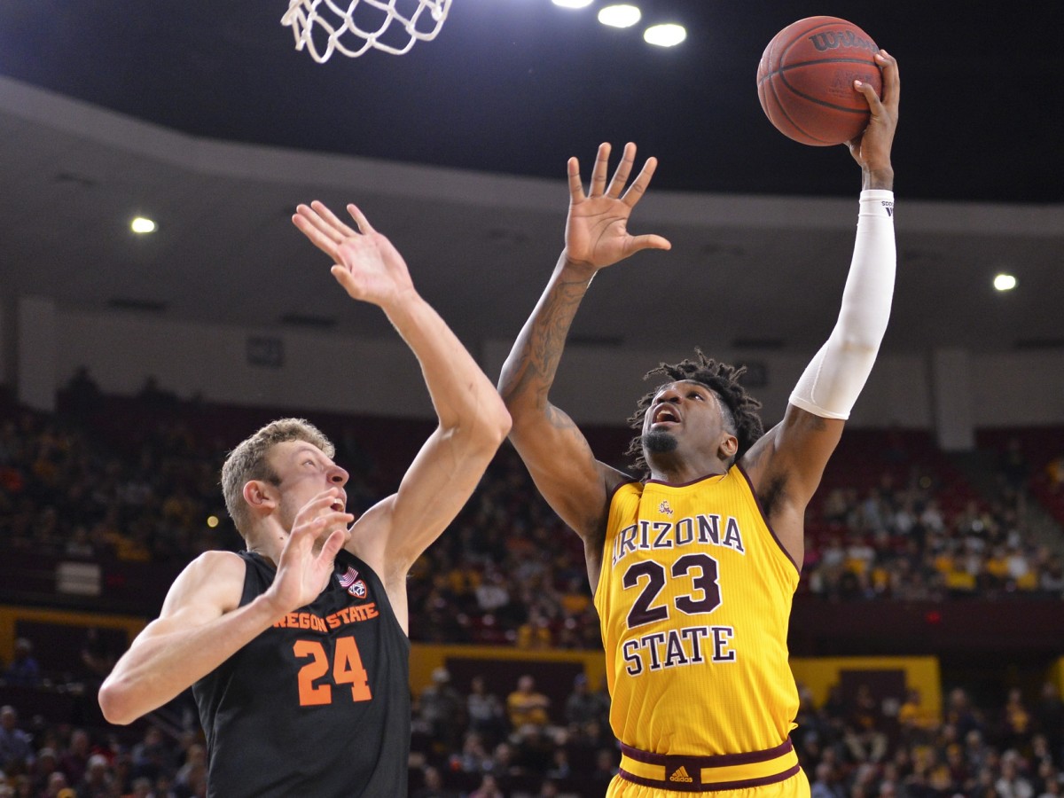 Arizona State Sun Devils forward Romello White (23) shoots the ball as Oregon State Beavers forward Kylor Kelley (24) defends during the second half at Desert Financial Arena. Mandatory Credit: Casey Sapio-USA TODAY Sports