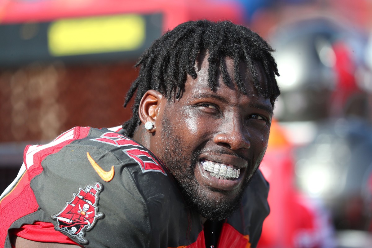 Dec 29, 2019; Tampa, Florida, USA; Tampa Bay Buccaneers linebacker Jason Pierre-Paul (90) looks on with his mouth grill against the Atlanta Falcons during the first half at Raymond James Stadium.