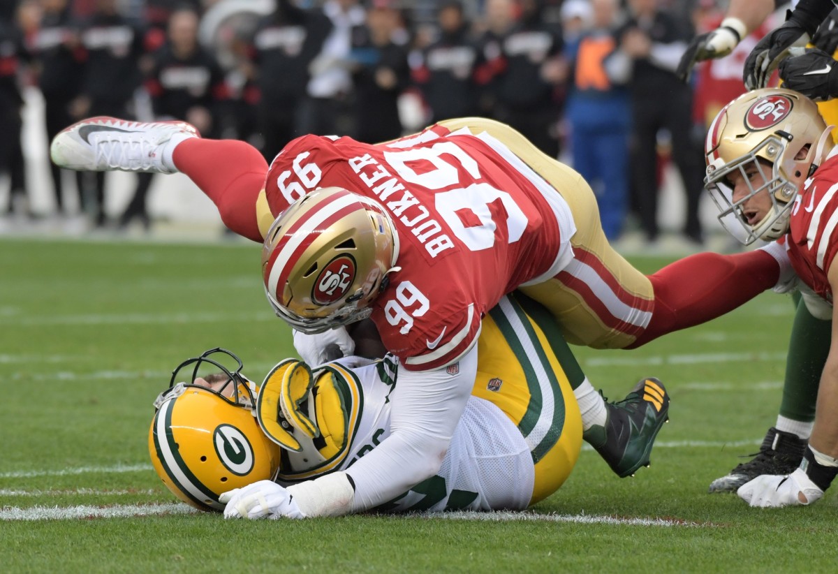 Defensive tackle DeForest Buckner, shown flattening Green Bay quarterback Aaron Rodgers, was acquired by the Indianapolis Colts in March to be a defensive cornerstone as a three-technique inside playmaker.