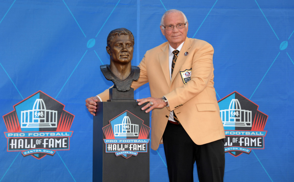 Aug 3, 2019; Canton, OH, USA; Johnny Robinson poses with bust during the Pro Football Hall of Fame Enshrinement at Tom Benson Hall of Fame Stadium. 