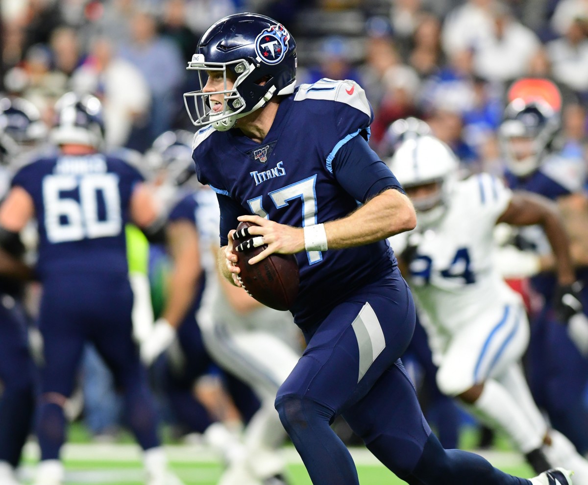 Tennessee Titans quarterback Ryan Tannehill tucks and runs in a 2019 road win against the Indianapolis Colts.