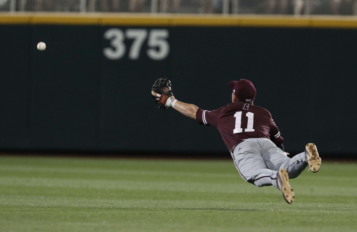 Jun 20, 2019; Omaha, NE, USA; Mississippi State Bulldogs shortstop Jordan Westburg (11) can t reach the fly ball in the eighth inning against the Louisville Cardinals in the 2019 College World Series at TD Ameritrade Park . Mandatory Credit: Bruce Thorson-USA TODAY Sports