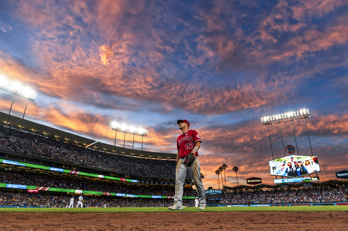 Mike Trout walking to dugout in Los Angeles sunset