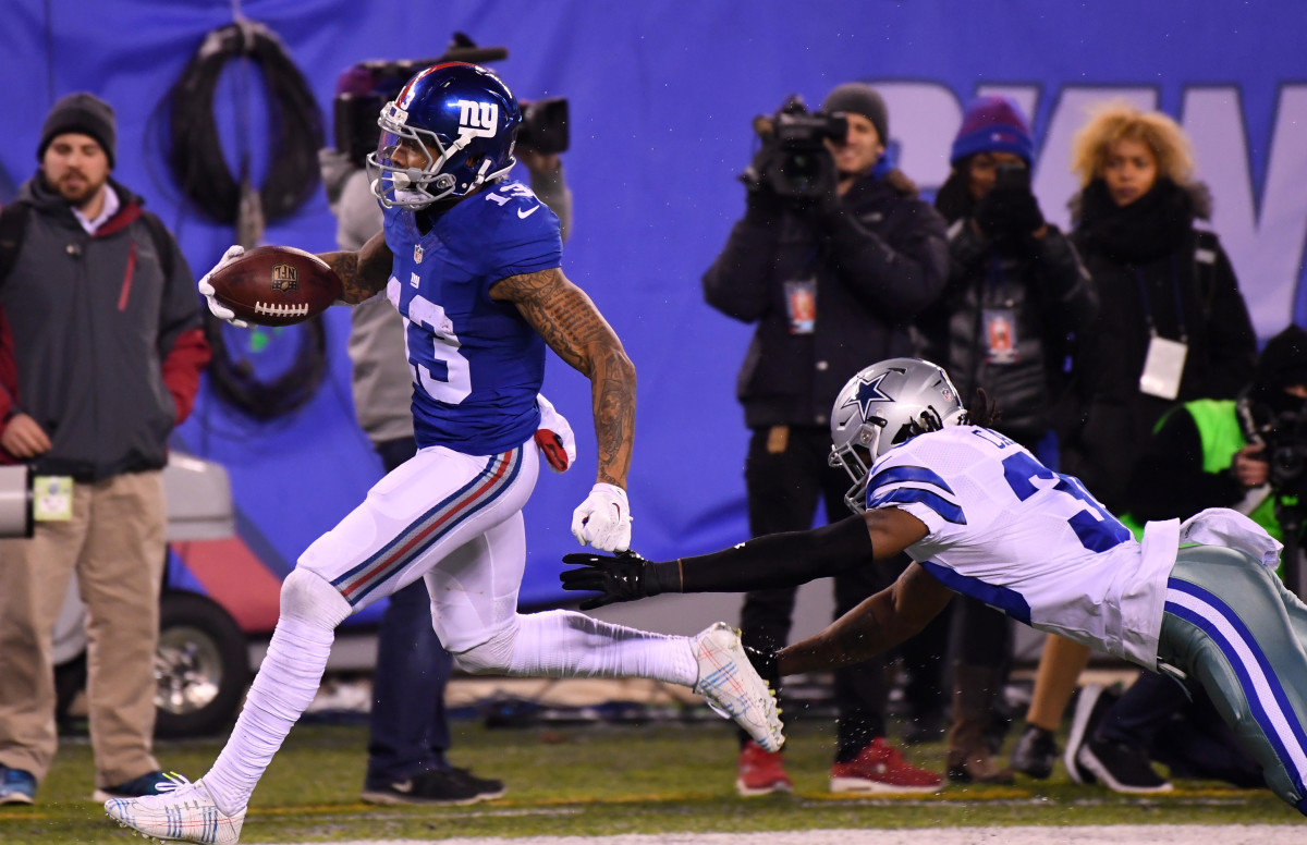 Dec 11, 2016; East Rutherford, NJ, USA; New York Giants wide receiver Odell Beckham (13) scores the game winning TD in the second half against the Dallas Cowboys at MetLife Stadium.