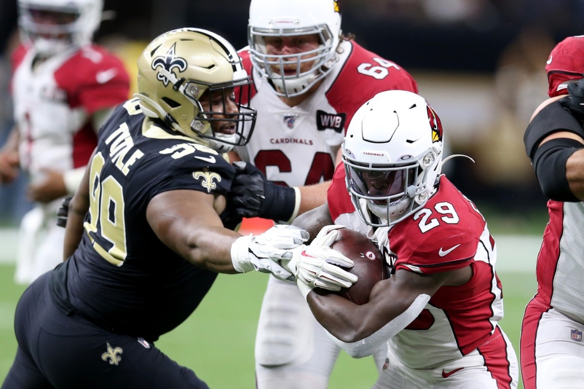 Oct 27, 2019; New Orleans, LA, USA; Arizona Cardinals running back Chase Edmonds (29) is defended by New Orleans Saints defensive tackle Shy Tuttle (99) in the first quarter at the Mercedes-Benz Superdome. Mandatory Credit: Chuck Cook-USA TODAY Sports
