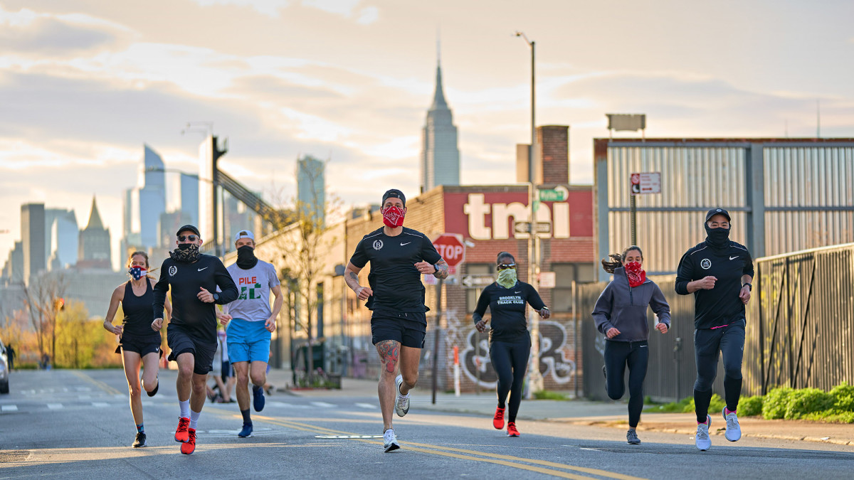 One of the few approved reasons for going outside in recent months is to get exercise, as mask-wearing members of the Brooklyn Track Club do.undefined