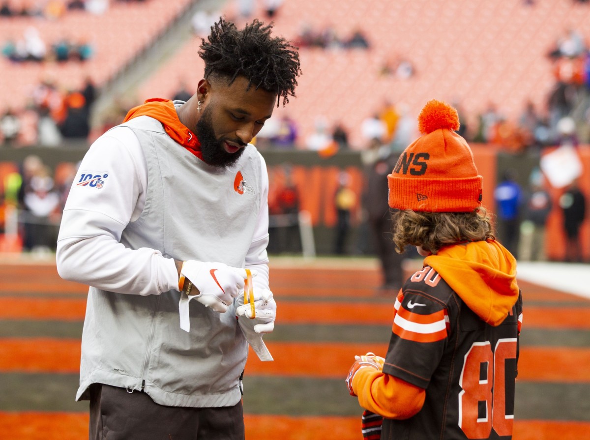 Nov 24, 2019; Cleveland, OH, USA; Cleveland Browns wide receiver Jarvis Landry (80) exchanges braclets with a fan during warmups before the game against the Miami Dolphins at FirstEnergy Stadium. Mandatory Credit: Scott R. Galvin-USA TODAY Sports