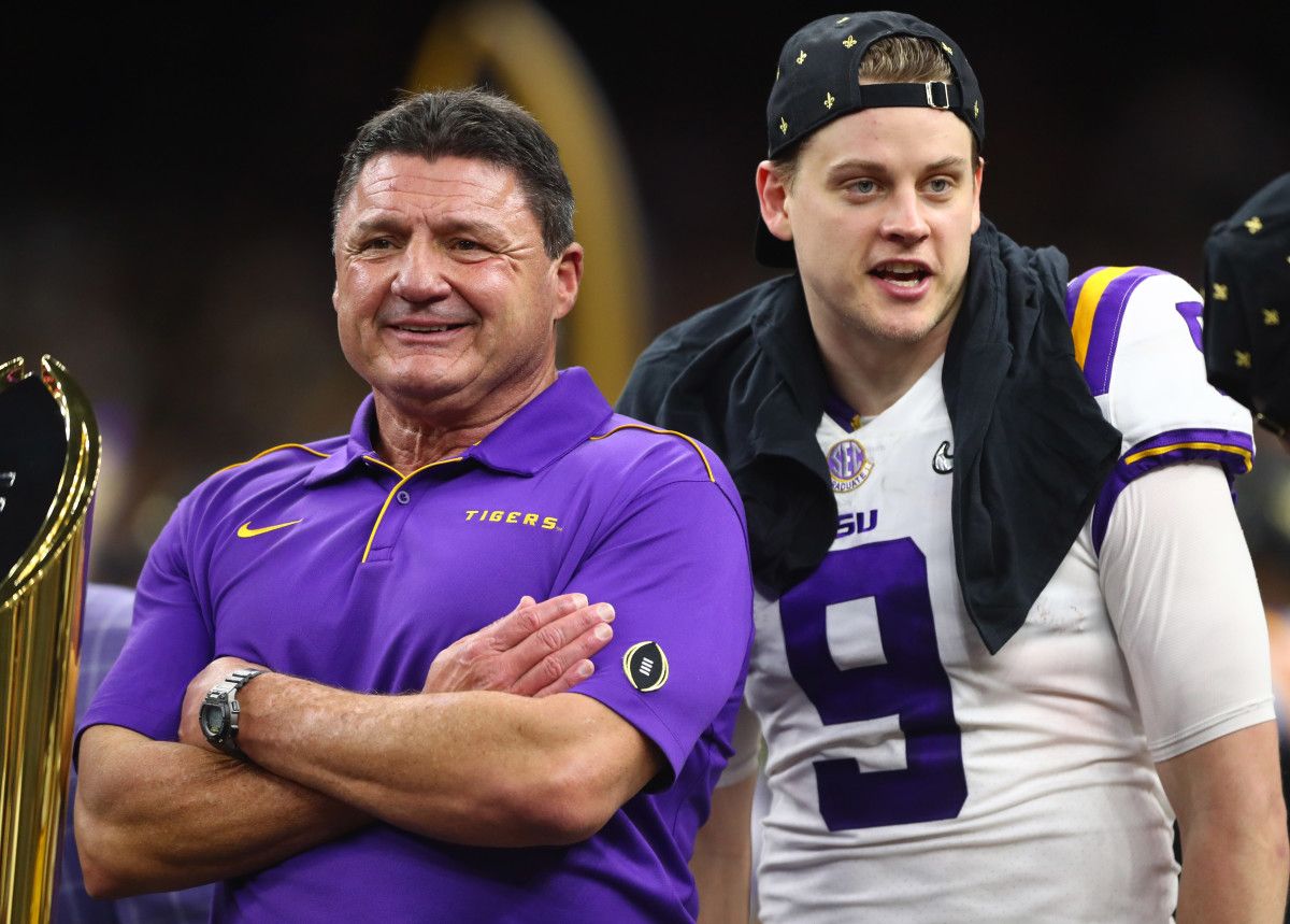 LSU Tigers head coach Ed Orgeron (left) with quarterback Joe Burrow after defeating the Clemson Tigers in the College Football Playoff national championship game at Mercedes-Benz Superdome.