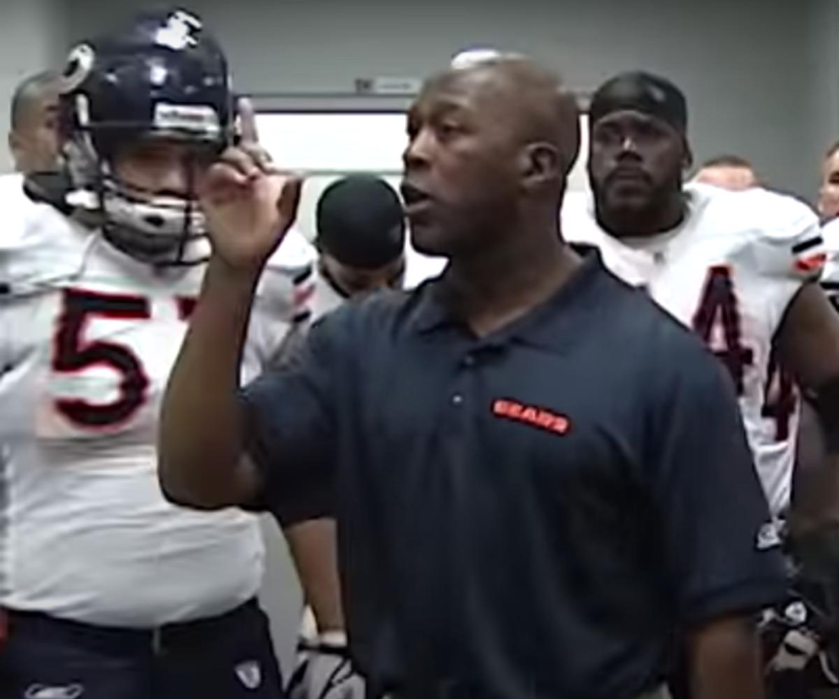 Lovie Smith speaking to the Chicago Bears players, with Olin Kreutz (57) in the background, during halftime of the Monday Night Football comeback win at Arizona in 2006.