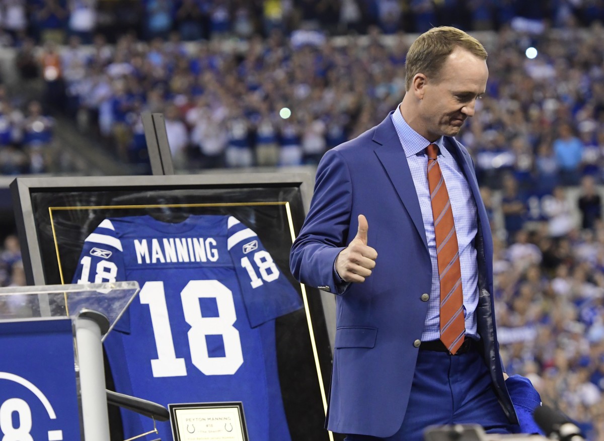 Retired quarterback Peyton Manning gives a thumbs up after being inducted into the Indianapolis Colts Ring of Honor in 2017 at Lucas Oil Stadium.