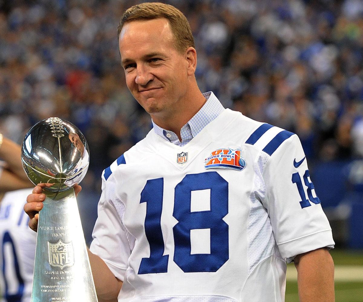 Quarterback Peyton Manning holds up the Vince Lombardi Trophy earned in the Indianapolis Colts' Super Bowl XLI triumph in 2007. The team was honored on the 10-hear anniversary of the championship at Lucas Oil Stadium.