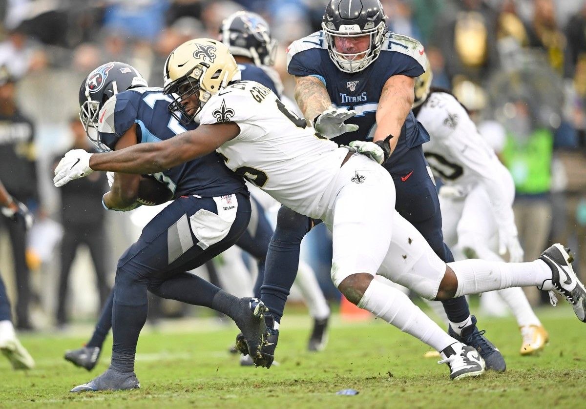 New Orleans Saints defensive end Carl Granderson (96) stops Tennessee Titans running back Dalyn Dawkins (28) during the second quarter at Nissan Stadium Sunday, Dec. 22, 2019 in Nashville, Tenn. Gw52772
