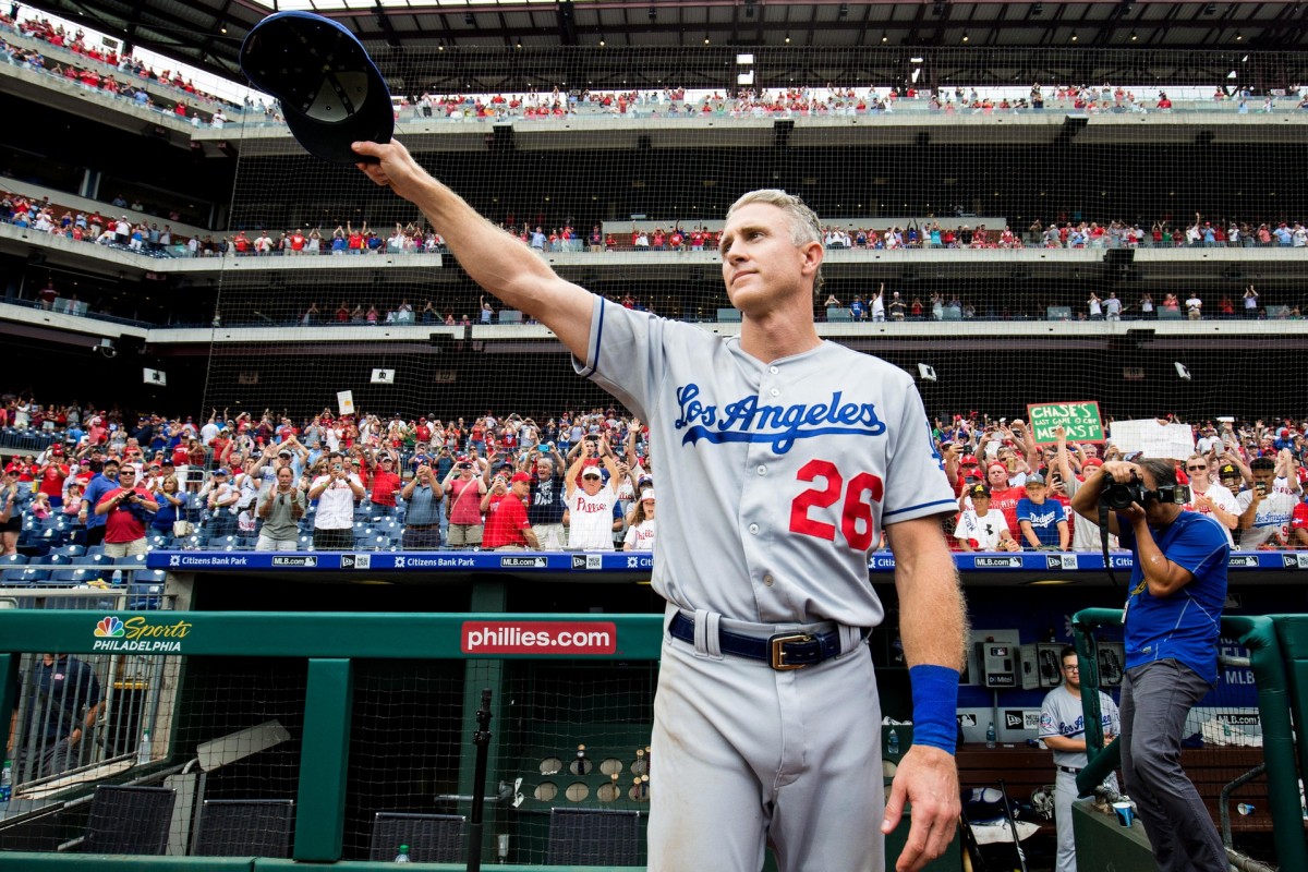 Jul 25, 2018; Philadelphia, PA, USA; Los Angeles Dodgers second baseman Chase Utley (26) tips his cap to fans after a game against the Philadelphia Phillies and his last regular season appearance at Citizens Bank Park. Mandatory Credit: Bill Streicher-USA TODAY Sports