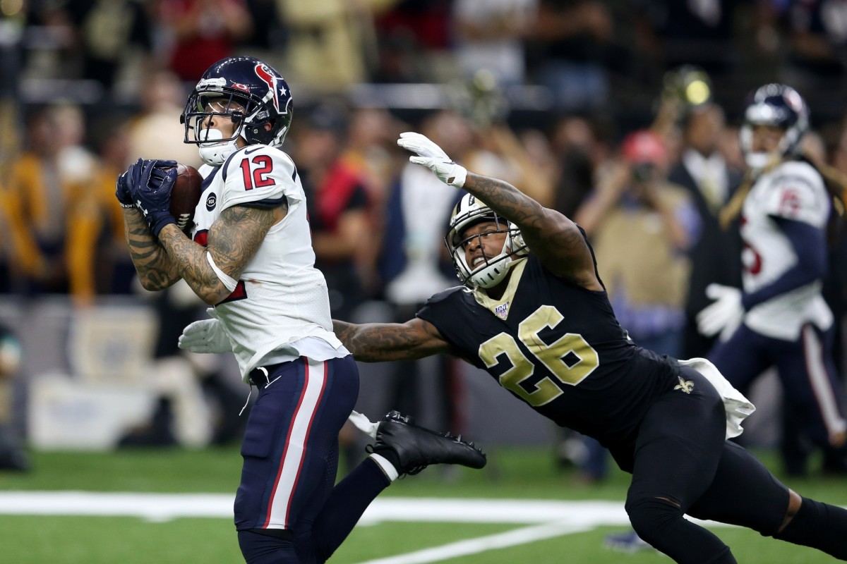 Sep 9, 2019; New Orleans, LA, USA; Houston Texans wide receiver Kenny Stills (12) makes a touchdown catch while defended by New Orleans Saints cornerback P.J. Williams (26) in the fourth quarter at the Mercedes-Benz Superdome. Mandatory Credit: Chuck Cook-USA TODAY Sports
