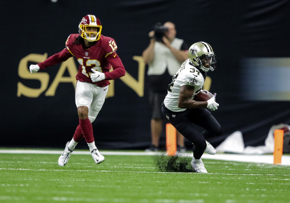 Oct 8, 2018; New Orleans, LA, USA New Orleans Saints cornerback Justin Hardee (34) intercepts a pass against Washington Redskins wide receiver Maurice Harris (13) during the third quarter at the Mercedes-Benz Superdome. The Saints defeated the Redskins 43-19.