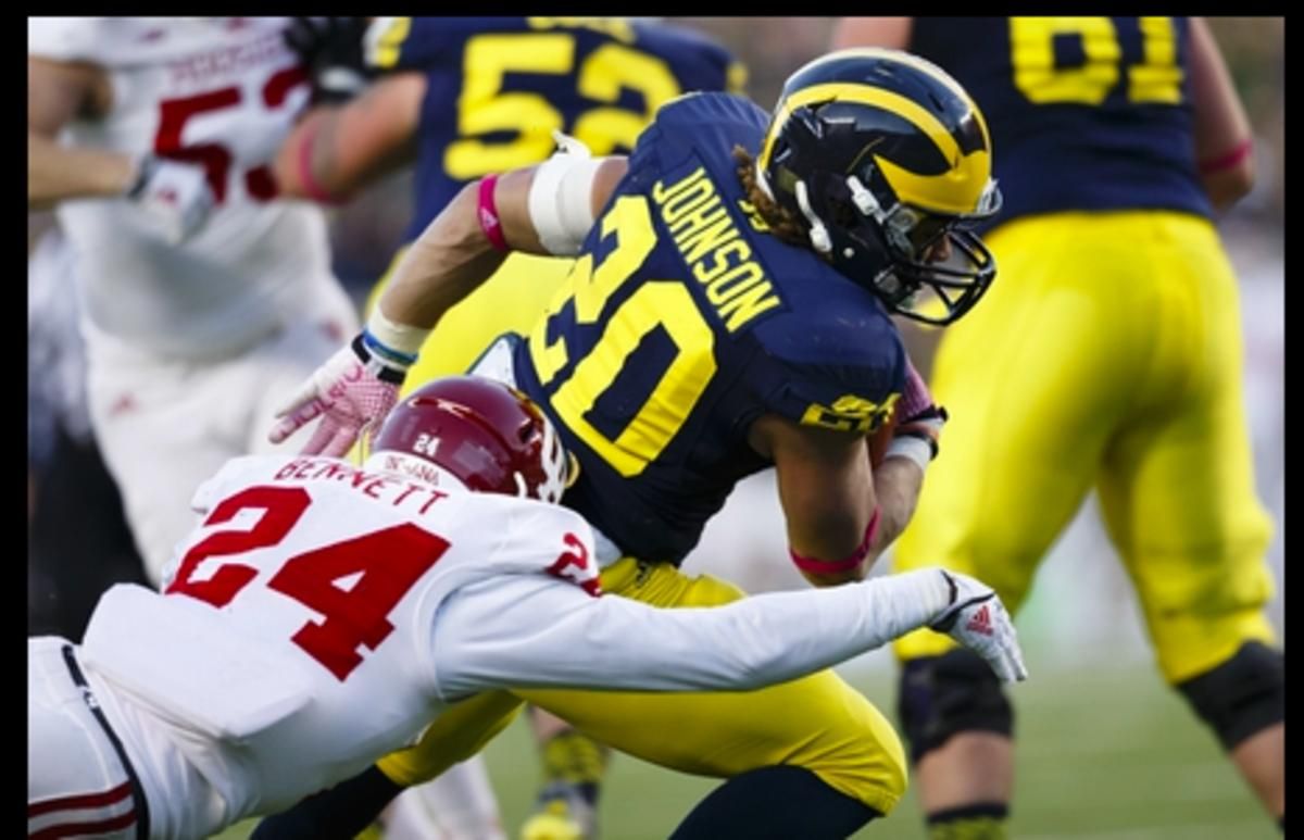 Former Indiana cornerback Tim Bennett makes a tackle against Michigan during a game in 2013. (USA TODAY Sports)