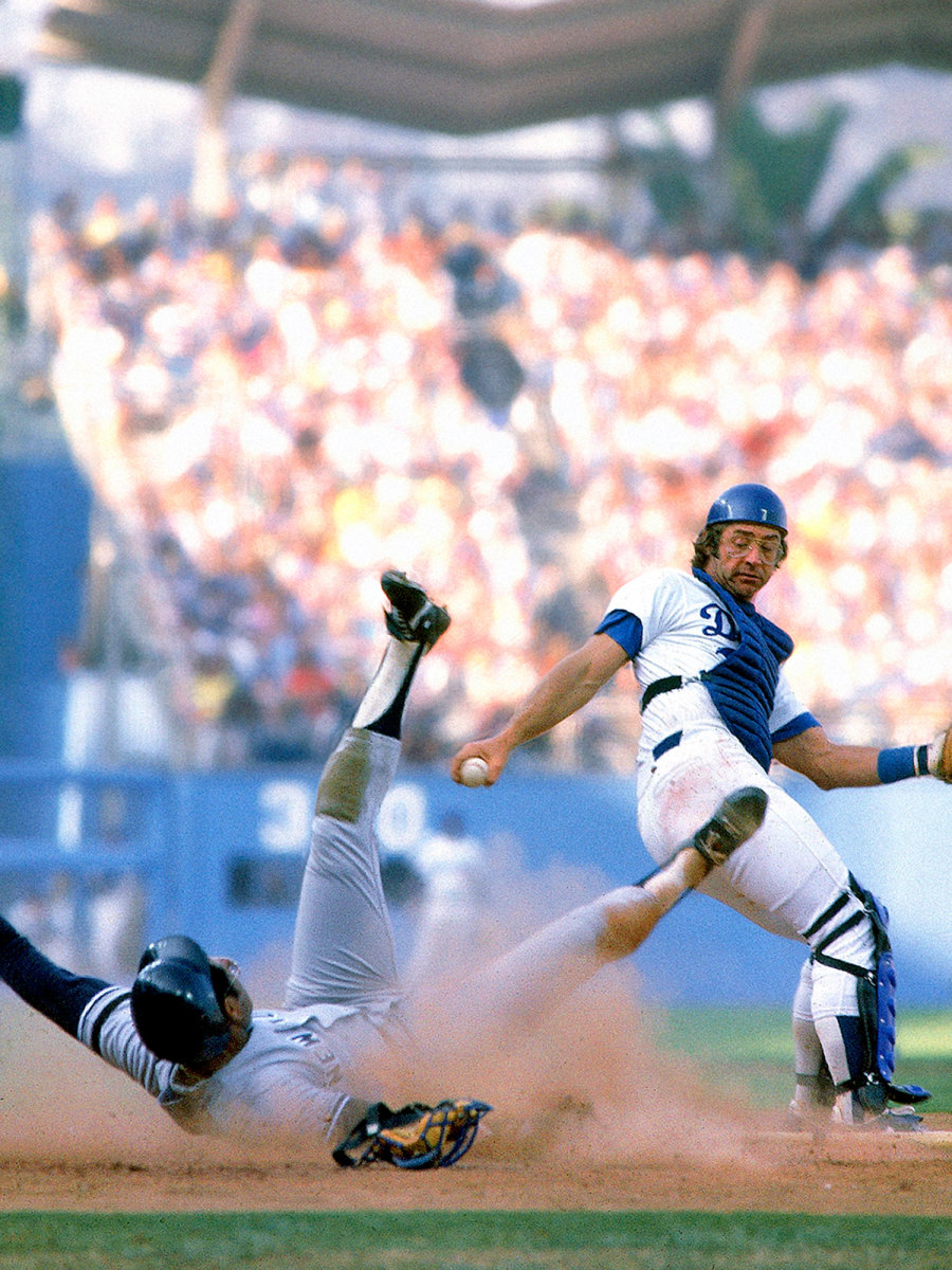 A Yankees player and Dodgers player collide at home plate during the 1981 World Series.