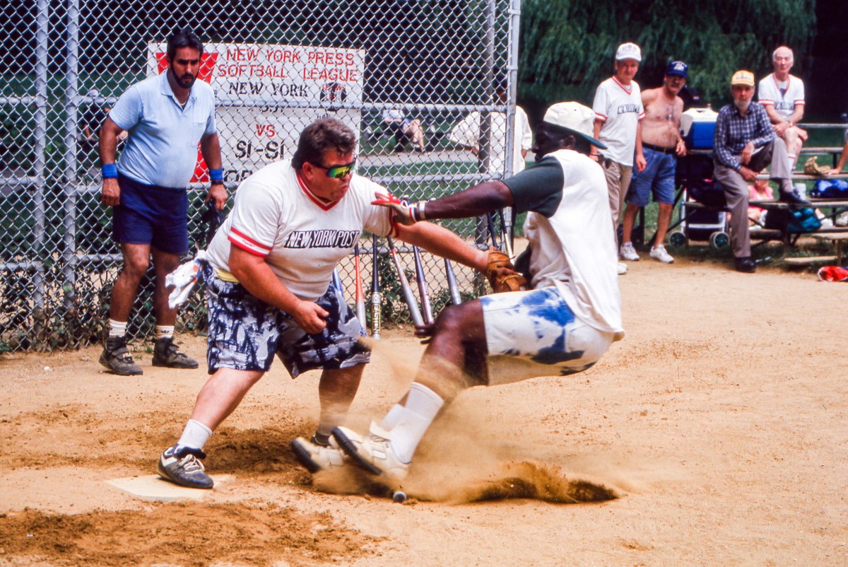 SI photo editor George Washington crashing "Catcher Joe" at home plate in 1995 against the Post.