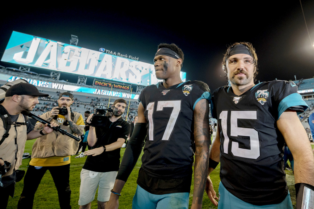 Dec 29, 2019; Jacksonville, Florida, USA; Jacksonville Jaguars quarterback Gardner Minshew II (15) and wide receiver DJ Chark Jr. (17) leave the field after defeating the Indianapolis Colts at TIAA Bank Field. Mandatory Credit: Douglas DeFelice-USA TODAY Sports