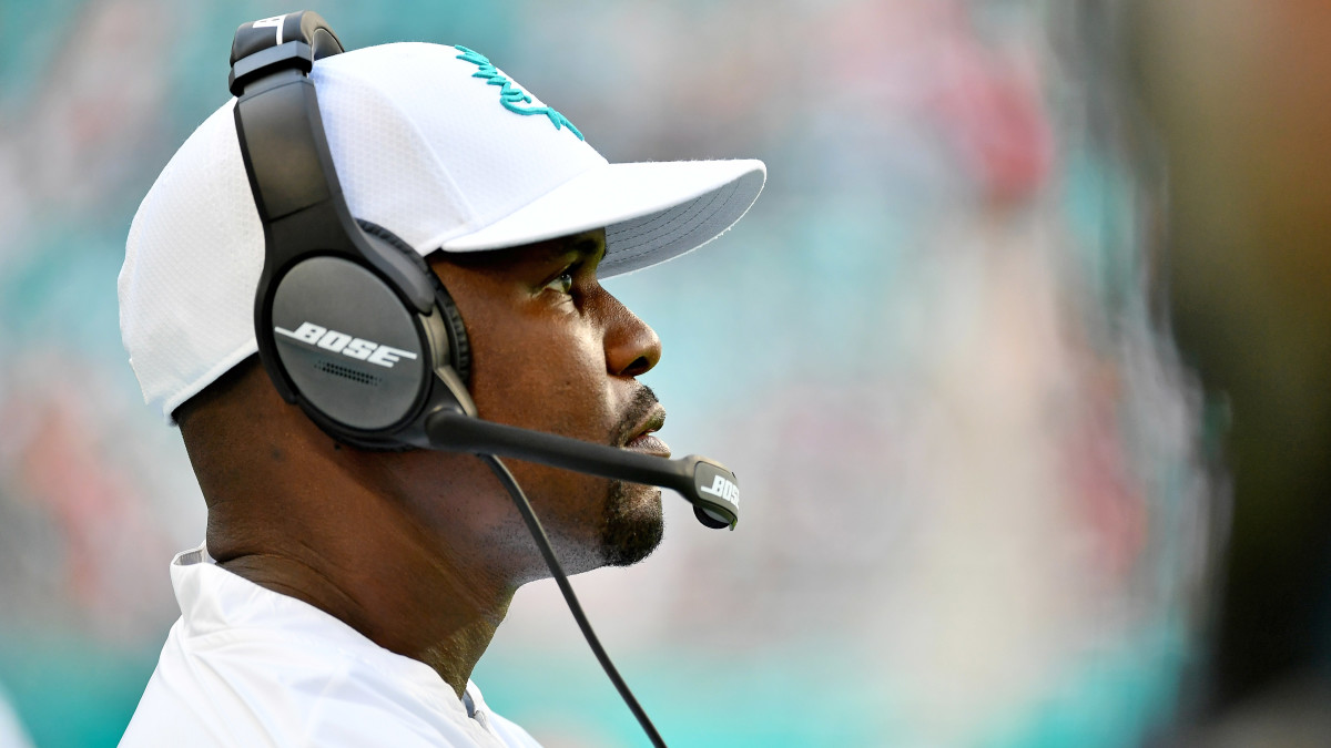 Dolphins coach Brian Flores looks on.