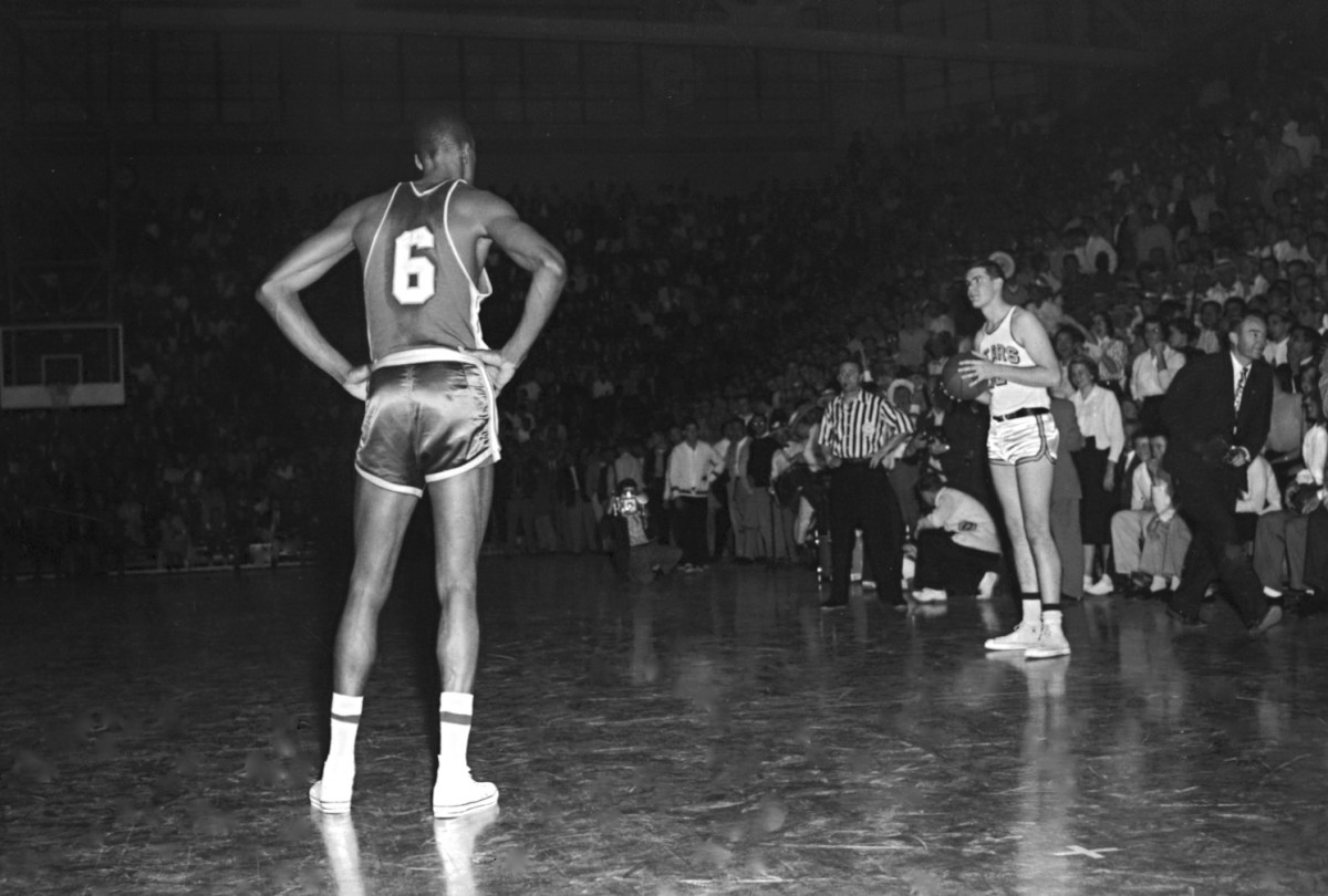 Bill Russell (6) watches patiently as Cal stalls against USF in 1956