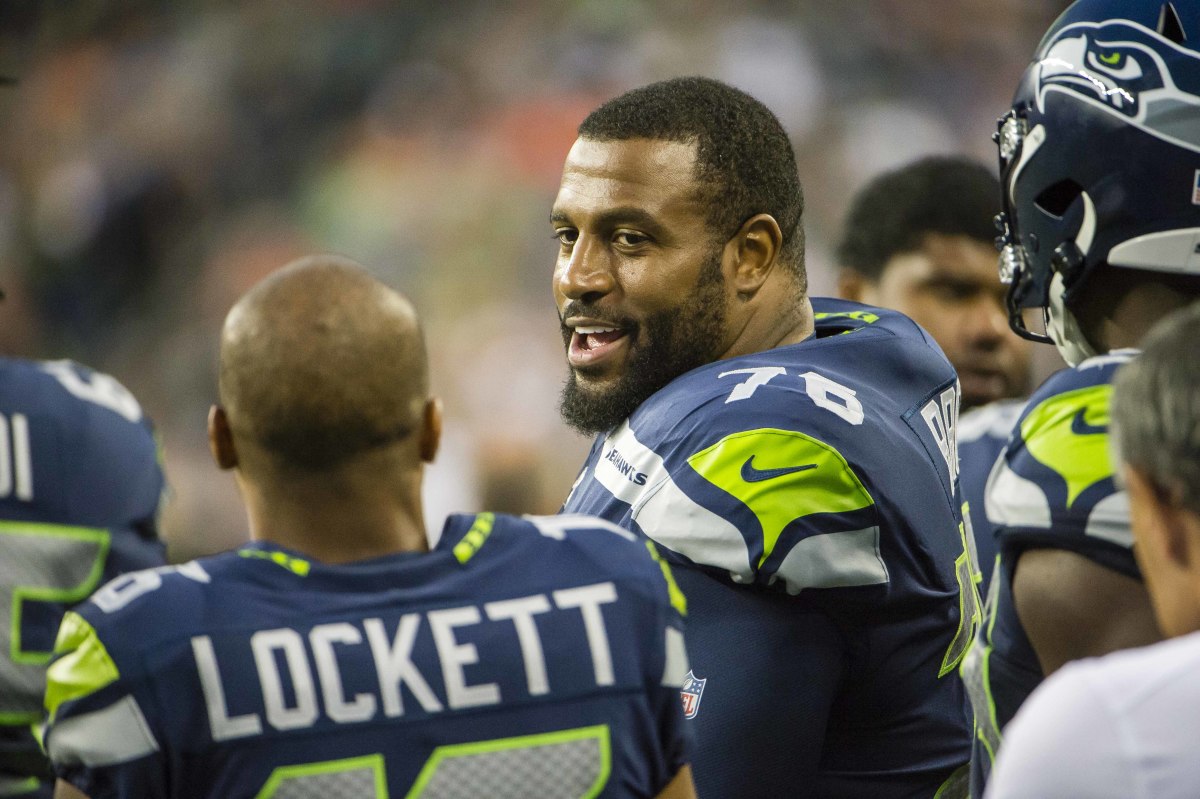Seattle Seahawks offensive tackle Duane Brown (76) talks to wide receiver Tyler Lockett (16) during the first half against the Denver Broncos at CenturyLink Field.