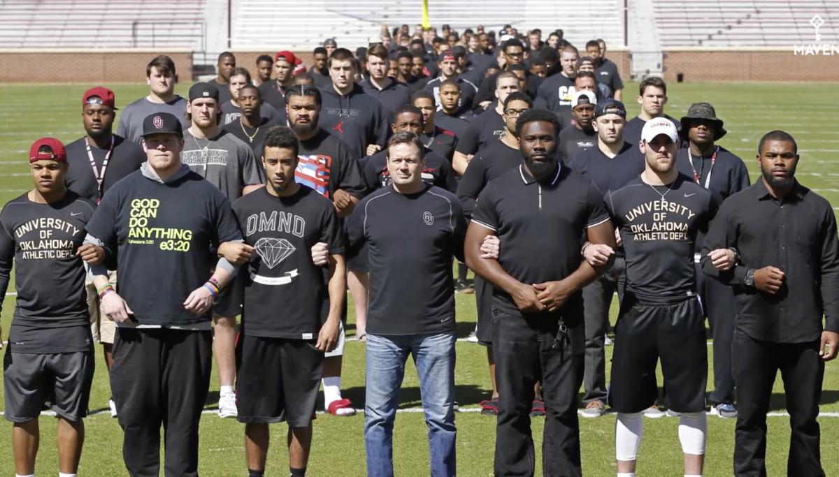 Oklahoma players and coaches protest in 2015 after a racist fraternity video surfaced online. 
