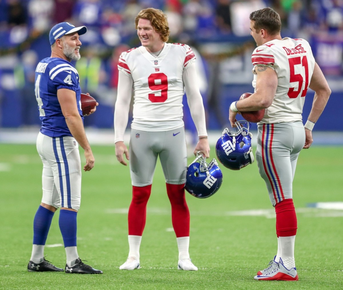 Indianapolis Colts kicker Adam Vinatieri (4) talks with New York Giants punter Riley Dixon (9) and long snapper Zak DeOssie (51) at Lucas Oil Stadium in Indianapolis on Sunday, Dec. 23, 2018. Indianapolis Colts Take On The New York Giants At Lucas Oil Stadium.