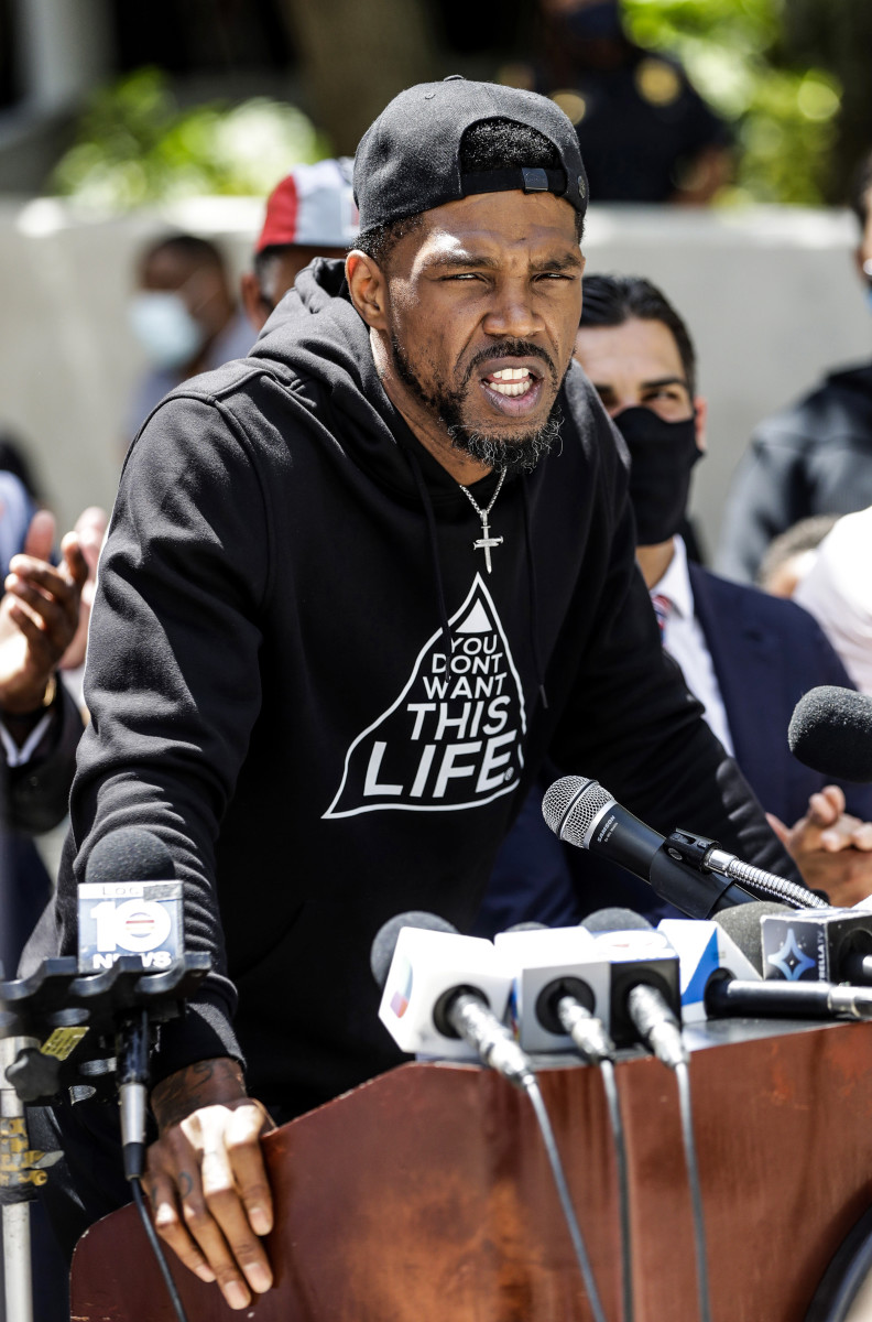 Udonis Haslem speaks during a news conference with the mayor of Miami