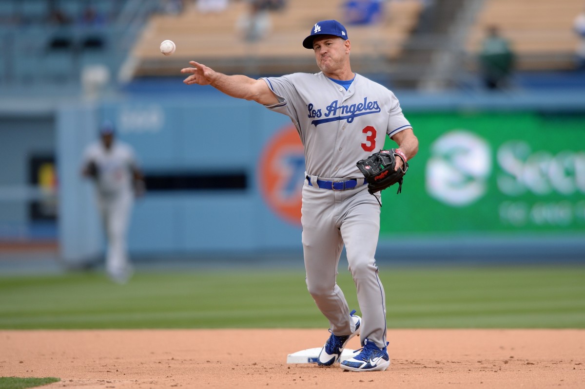 May 12, 2018; Los Angeles, CA, USA; Los Angeles Dodgers former player Steve Sax throws to first base during the Dodgers Alumni game before a game between the Dodgers and the Cincinnati Reds at Dodger Stadium. Mandatory Credit: Orlando Ramirez-USA TODAY Sports