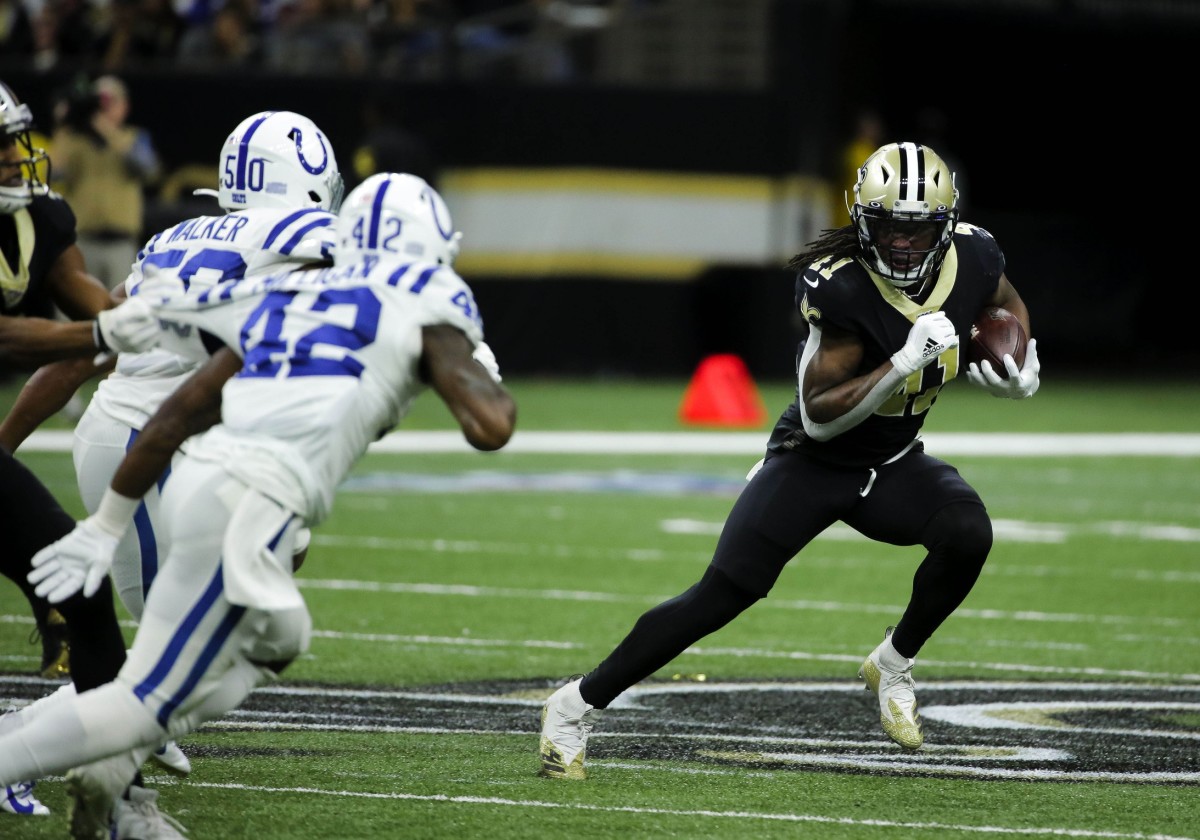Dec 16, 2019; New Orleans, LA, USA; New Orleans Saints running back Alvin Kamara (41) runs past Indianapolis Colts defensive back Rolan Milligan (42) during the first half at the Mercedes-Benz Superdome. Mandatory Credit: Derick E. Hingle-USA TODAY