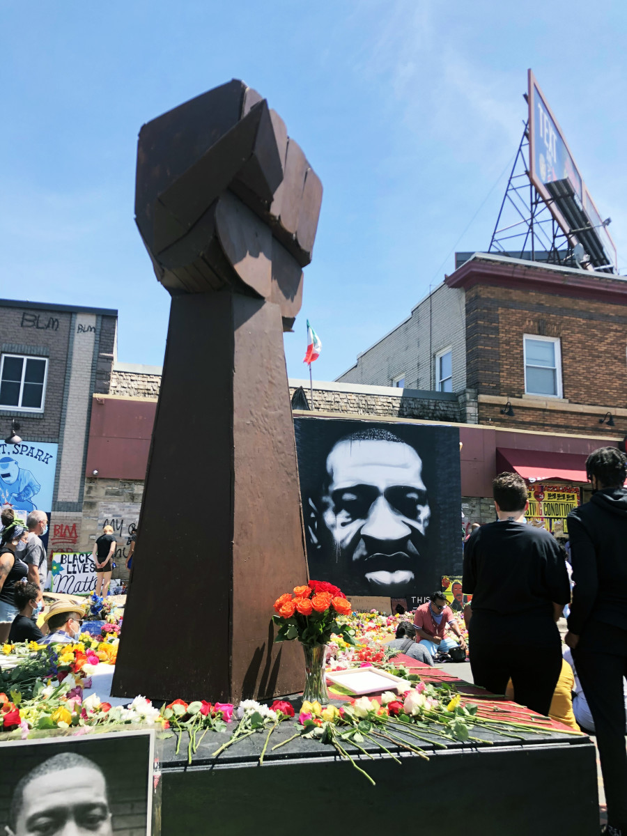 A fist statue at a memorial for George Floyd