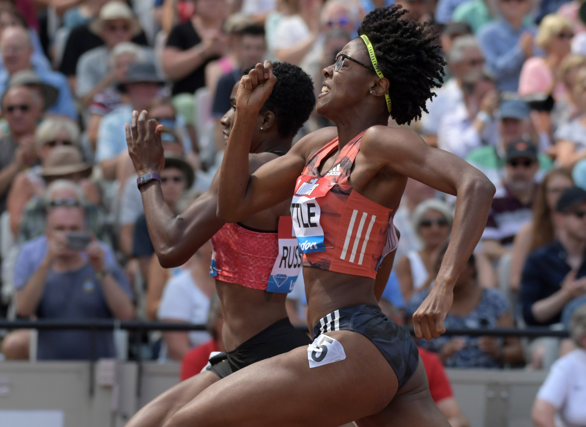 London, United Kingdom; Shamier Little (USA), right, defeats Janieve Russell (JAM) to win the women's 400m hurdles, 53.95 to 53.96, during the London Anniversary Games at Olympic Stadium at Queen Elizabeth Olympic Park. Mandatory Credit: Kirby Lee-USA TODAY Sports