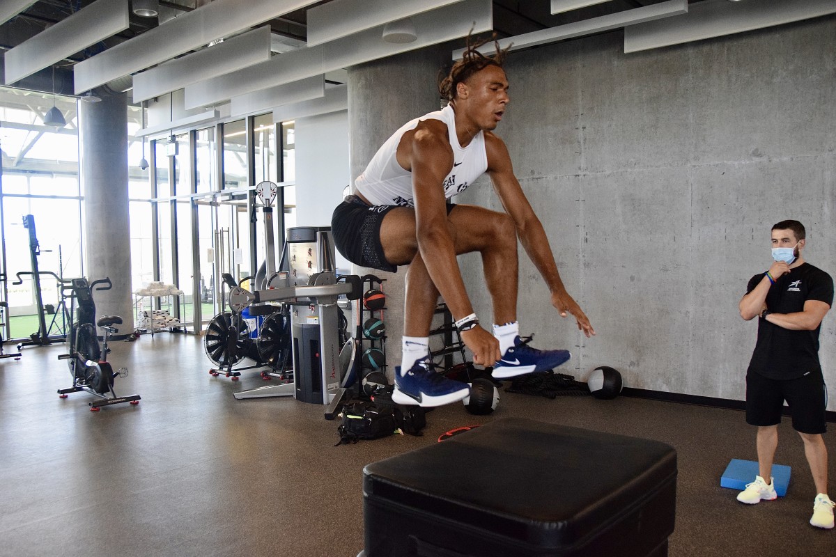 Blaine during a box jump in his workout at The Star in Frisco