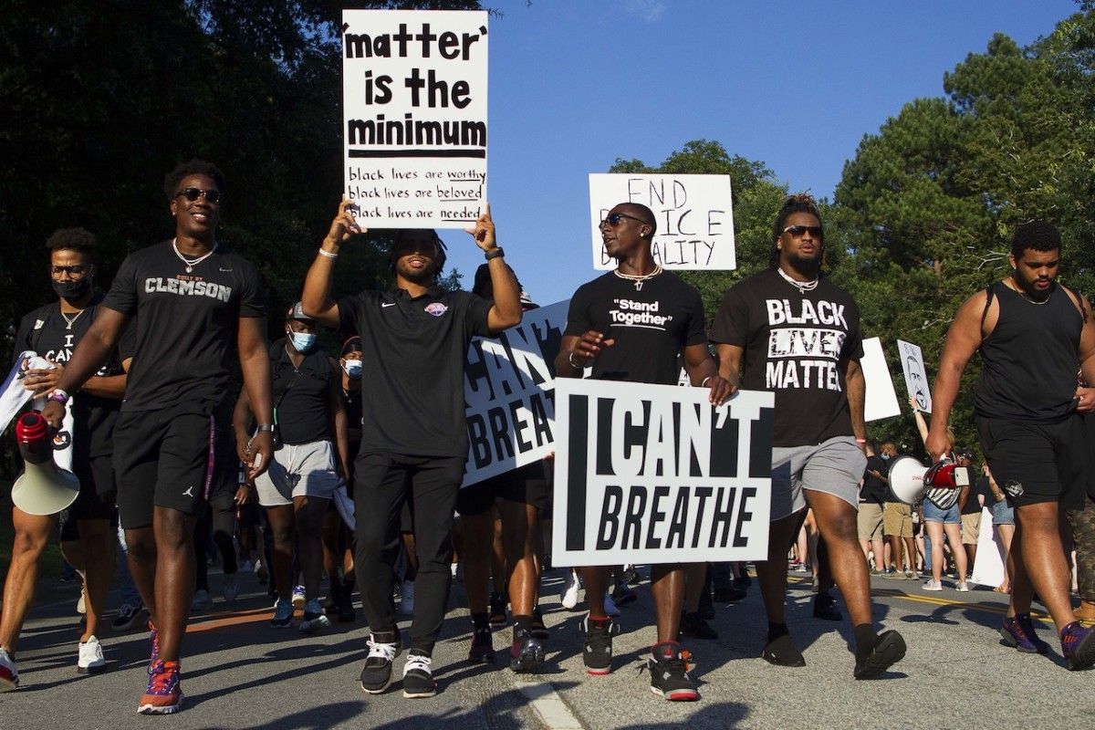 Darien Rencher (center left) and Cornell Powell (center right)