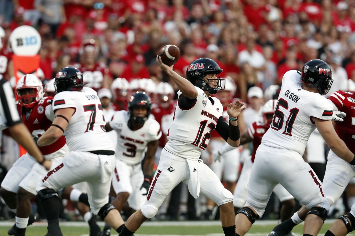 Northern Illinois Huskies quarterback Ross Bowers (12) throws against the Nebraska Cornhuskers in the first half of a 2019 game at Memorial Stadium in Lincoln, Nebraska.