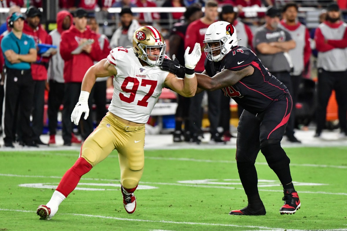 Oct 31, 2019; Glendale, AZ, USA; Arizona Cardinals offensive tackle D.J. Humphries (74) defends against San Francisco 49ers defensive end Nick Bosa (97) during the first quarter at State Farm Stadium.