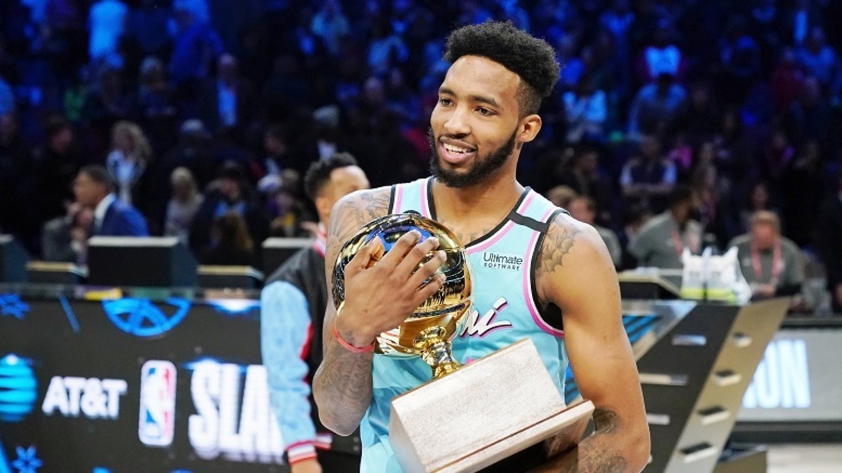 Miami Heat forward Derrick Jones, Jr. holds the trophy after winning the slam dunk contest during NBA All-Star Saturday Night at United Center.