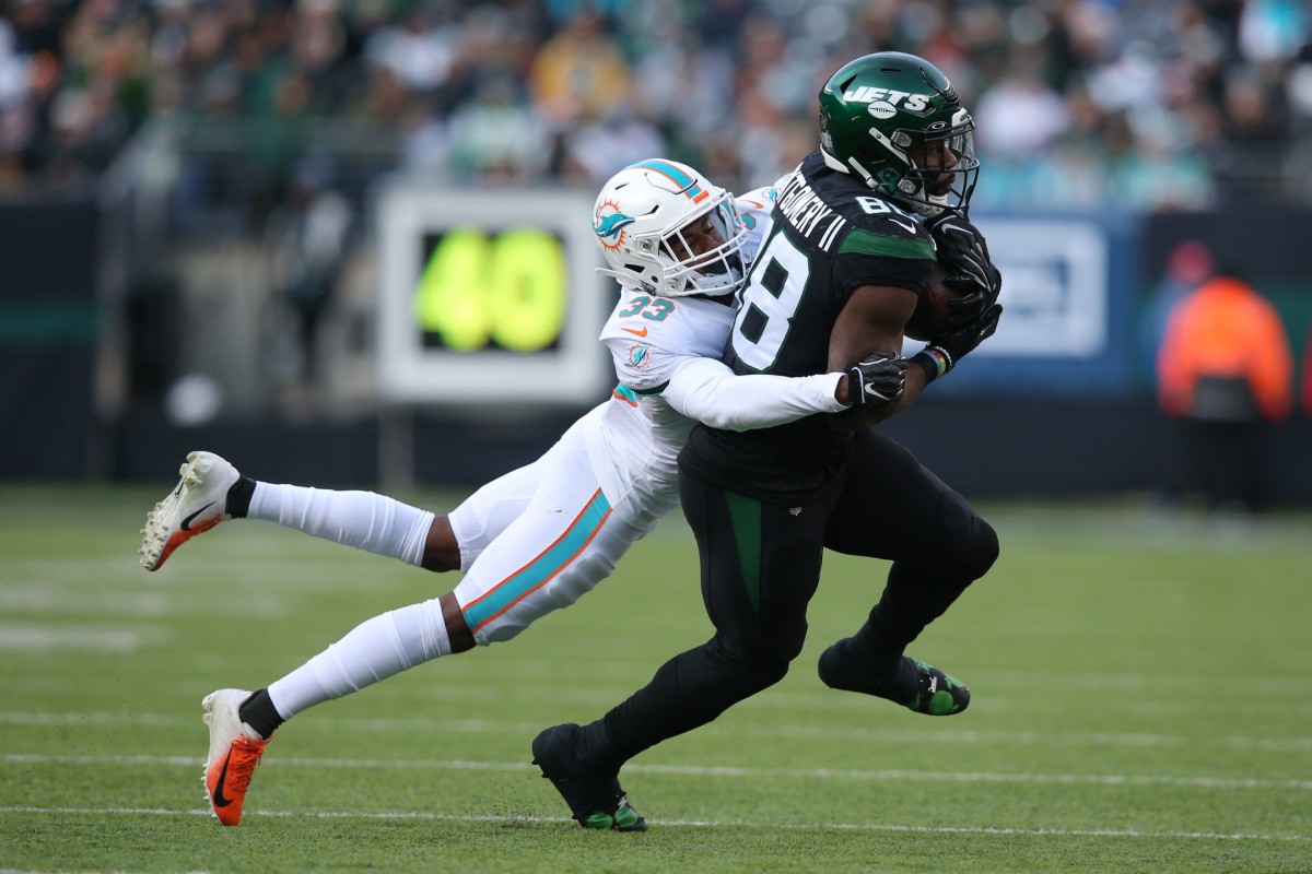 Dec 8, 2019; East Rutherford, NJ, USA; New York Jets running back Ty Montgomery (88) is tackled by Miami Dolphins cornerback Jomal Wiltz (33) during the third quarter at MetLife Stadium. Mandatory Credit: Brad Penner-USA TODAY Sports