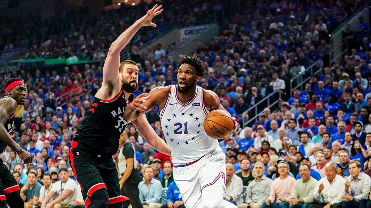 Joel Embiid drives against the Raptors