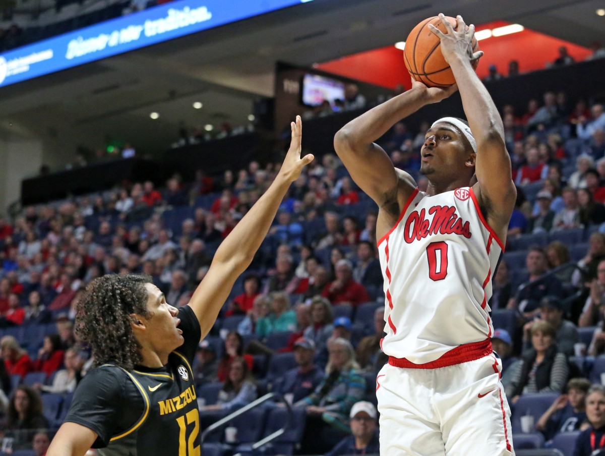 Mississippi Rebels guard Blake Hinson (0) shoots for three over Missouri Tigers guard Dru Smith (12) during the second half at The Pavilion at Ole Miss. Mandatory Credit: Petre Thomas-USA TODAY Sports