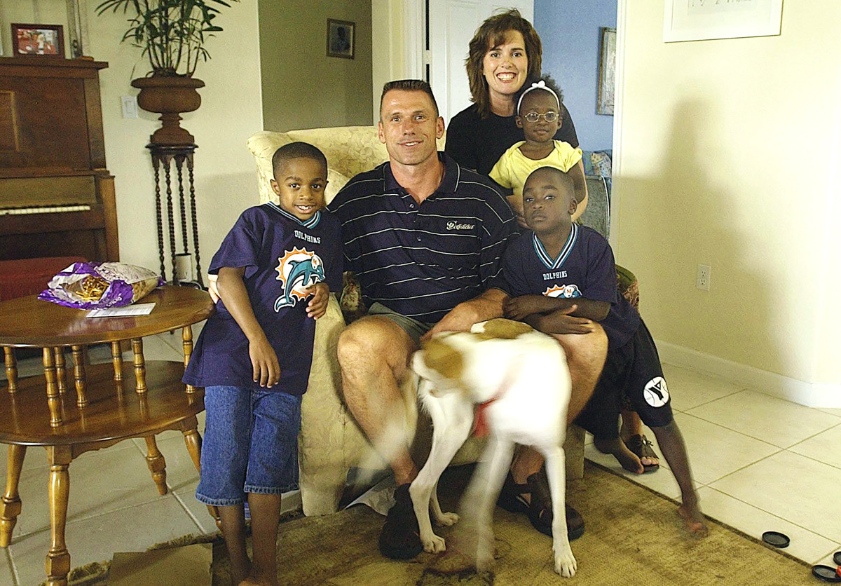 Spielman and his wife, Michele, with three of their adopted children.