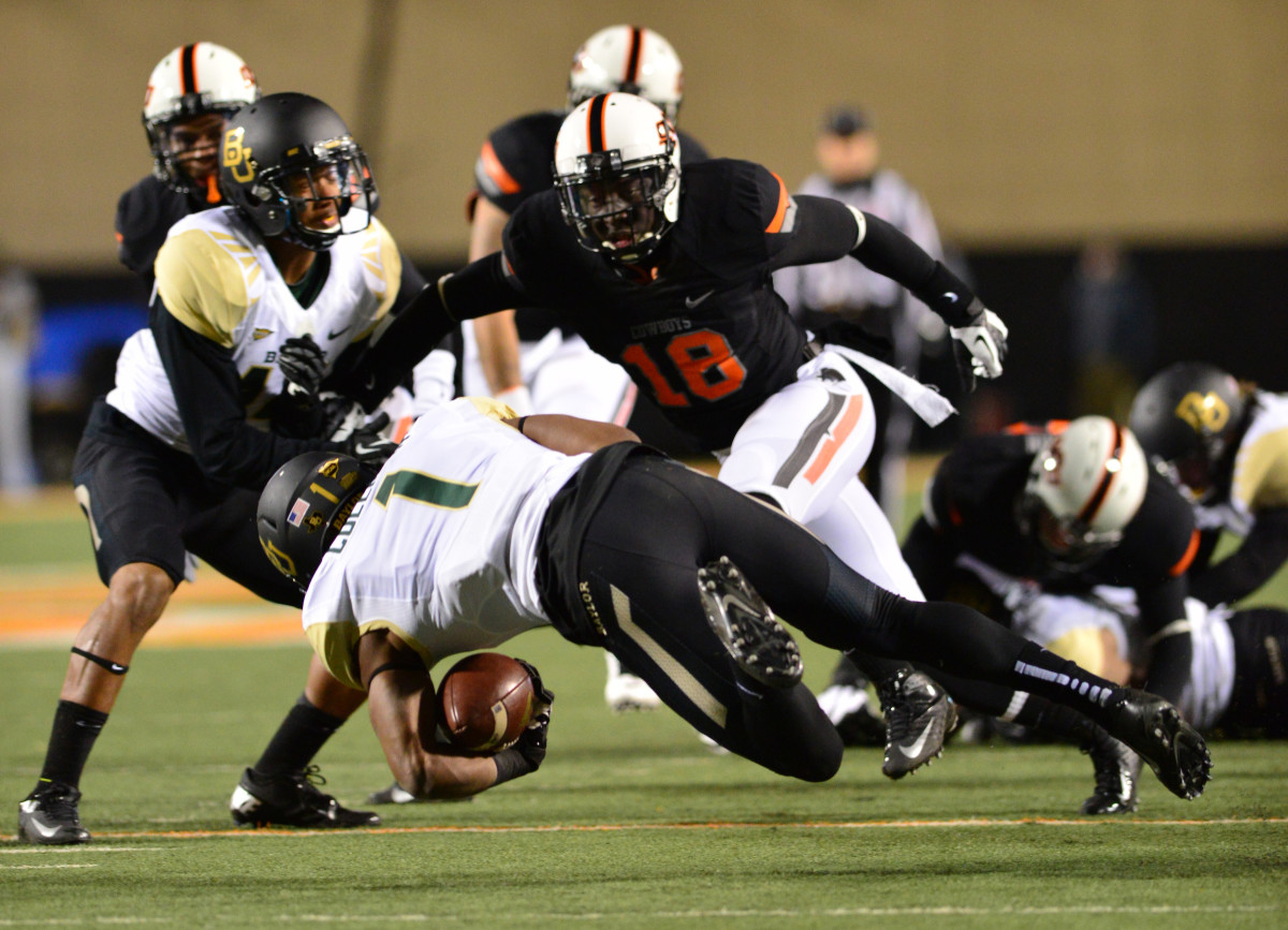Deion Imade (18) preparing to make a tackle against Baylor in a big win at the end of the 2013 season.