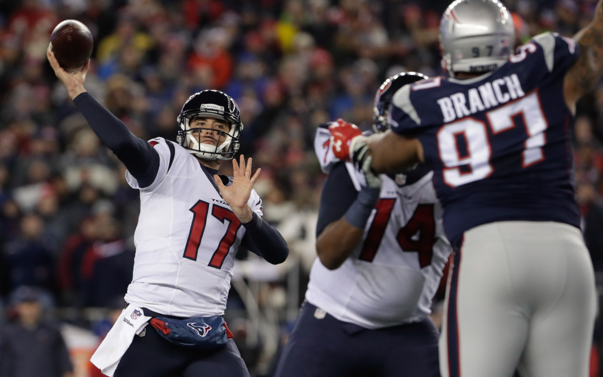 Texans quarterback Brock Osweiler throws a pass against the Patriots in a playoff matchup.