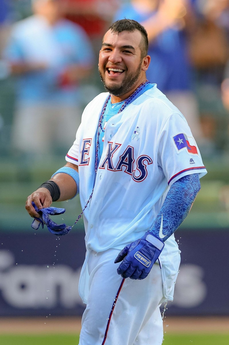 Jun 17, 2018; Arlington, TX, USA; Texas Rangers catcher Jose Trevino (71) is dunked with Powerade after his game winning 2-run single against the Colorado Rockies at Globe Life Park in Arlington. Credit: Andrew Dieb-USA TODAY Sports